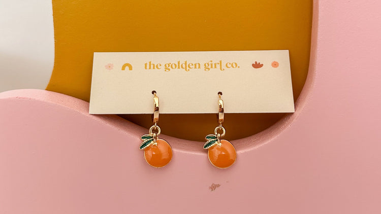 Orange Huggie Hoops